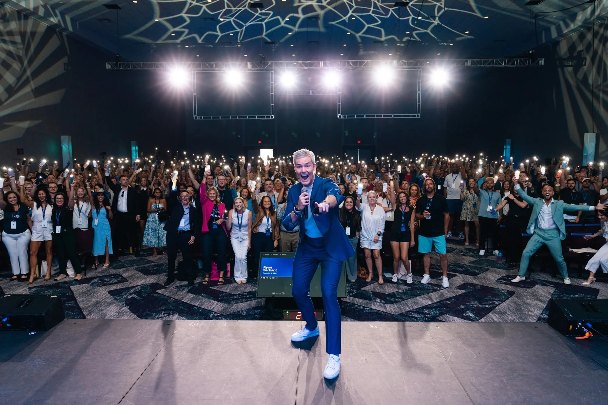 Ryan Serhant speaking to a large audience